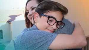 Boy Hugging Mom